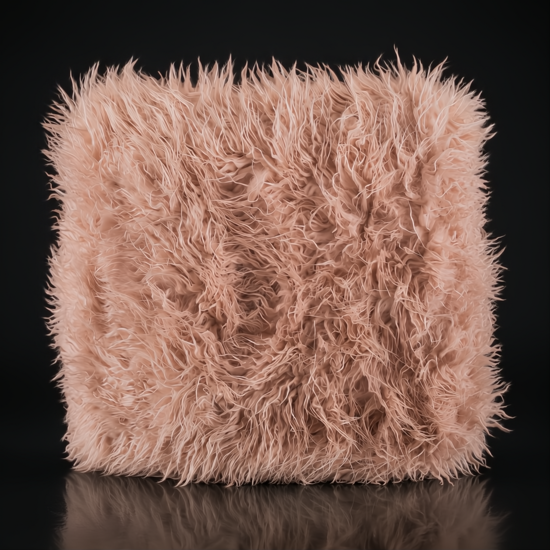 Soft, plush pink faux fur throw with shaggy texture, perfect for cozy home decor.