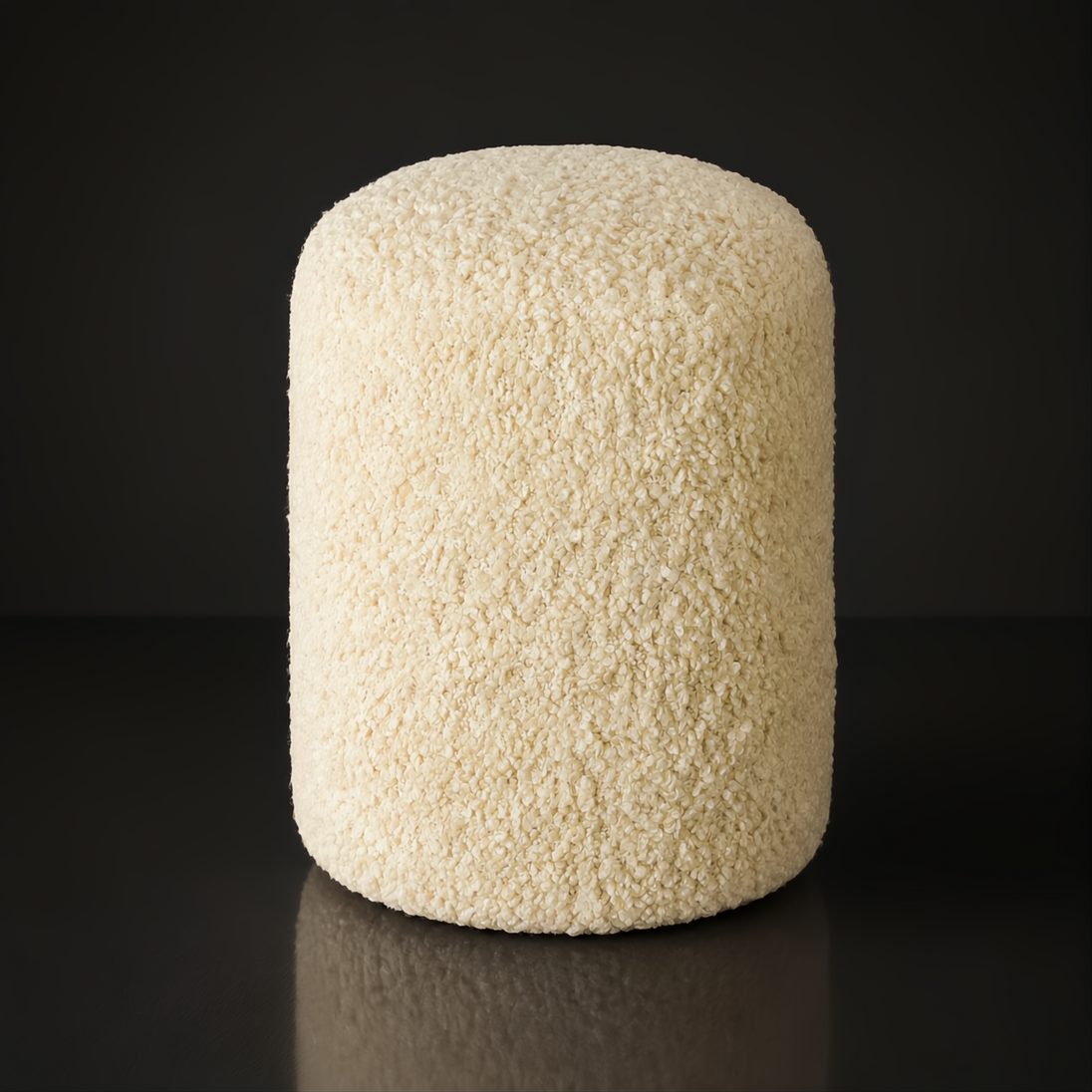 Surya Mohave Pouf, a cream-colored, textured polyester pouf with a rounded cube design.