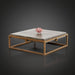 Industrial-modern concrete coffee table with a sleek metal frame, featuring a pink coral decor.