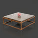 Industrial-modern square concrete coffee table with a sleek bronze metal frame, featuring a coral accent.