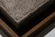 Industrial-modern coffee table with a textured gray concrete top and a dark bronze metal base.