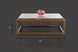Industrial-modern concrete coffee table with a gray top and a bronze metal frame. 42" long, 15" high.