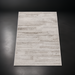 Surya Floria hand-woven rug, light beige recycled PET yarn, low-profile, neutral tones.