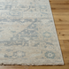 Hand-knotted Surya Cappadocia wool rug with light beige and faded blue traditional pattern, fringe detail.