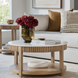 Surya Rosemary white marble top coffee table with a fluted mango wood base and lower shelf.
