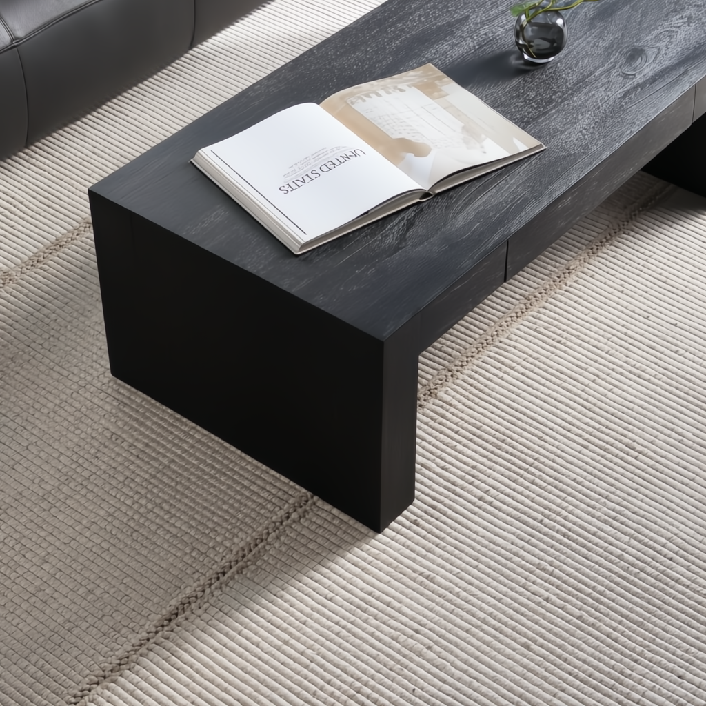 Surya Coburn black brushed mango wood coffee table with storage drawer on a light rug.