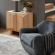 Surya Perch Accent Chair with medium gray polyester upholstery and brown lacquered rubber wood base.