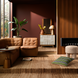 Surya Oryan RYAN-001 modular sofa in brown leather with a black base, in a modern living room.