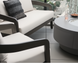 Surya Daniella outdoor loveseat and armchair with white Sunbrella cushions and gray aluminum frames.