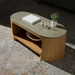 Surya Poros coffee table with green cork veneer top and brown oak base on a patterned rug.