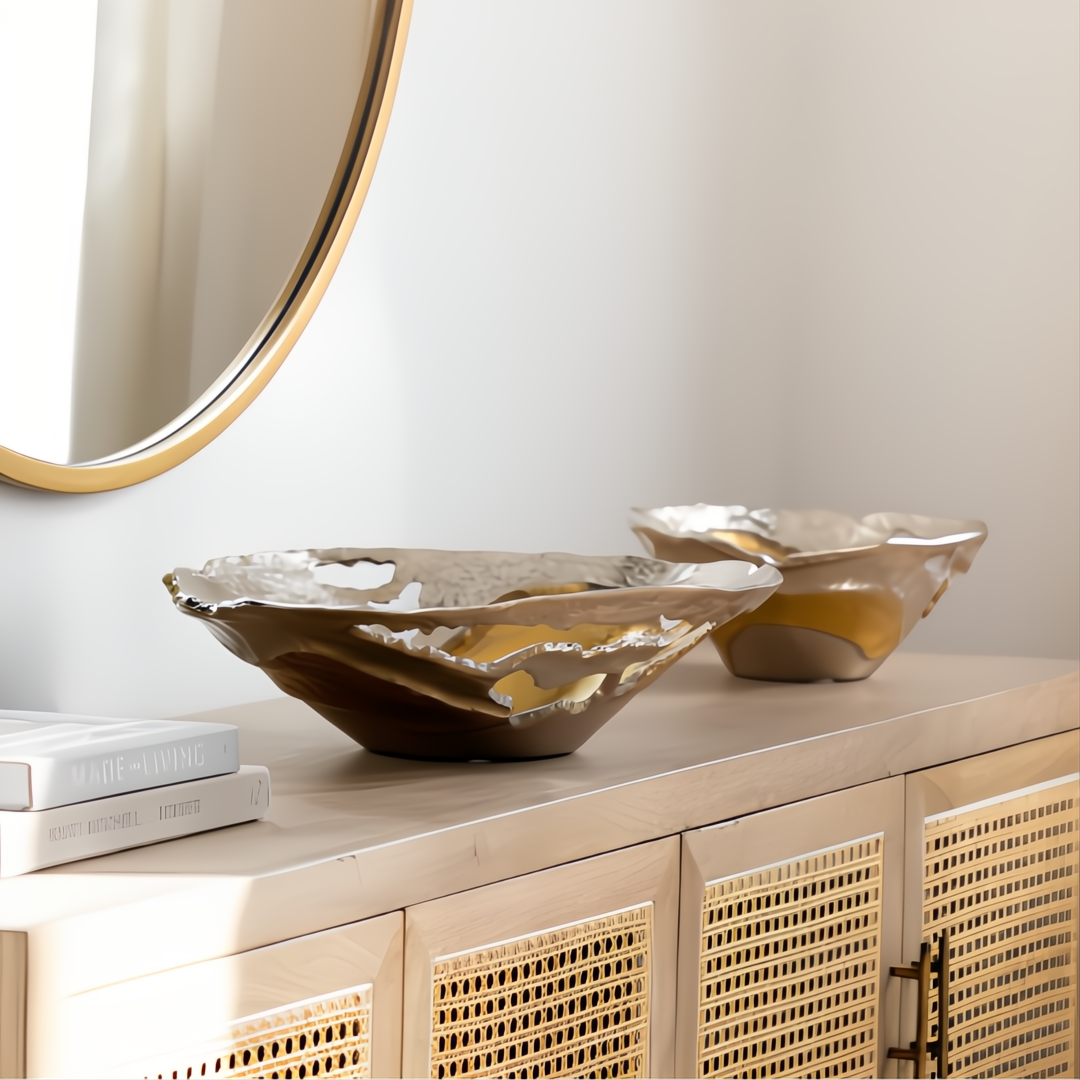 Surya Ambrosia AOA-003 decorative aluminum accent bowls with metallic finish on a light wood console.