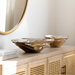 Surya Ambrosia AOA-003 decorative aluminum accent bowls with metallic finish on a light wood console.