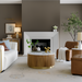 Surya Nems round coffee table with white marble top, reeded brown mango wood base, and gold accents in a living room.
