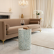 Round Surya Iridescent End Table with multi-tone shell detailing in tan, ivory, gray, denim, and ice blue.