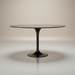 Surya Anatalia round dining table with a black polished marble top and black powder-coated iron tulip base.
