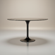 Surya Anatalia round dining table with a black polished marble top and black powder-coated iron tulip base.