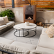 Cream glazed ceramic Surya Cirio outdoor vase set on a modern patio coffee table.