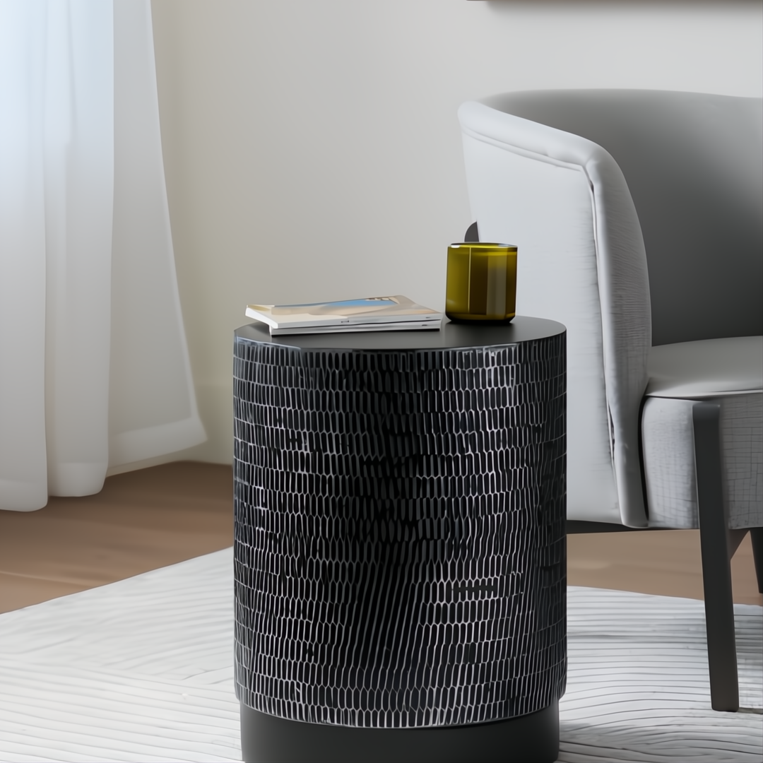 Surya Amenet round end table with black antiqued powder-coated iron base and hammered detailing.