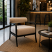 Surya Antibes ANTE-001 outdoor accent chair with light beige Sunbrella fabric and black aluminum frame.