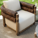 Surya Porta Swivel Chair with light beige Sunbrella cushions, brown handwoven PE wicker, and aluminum base.