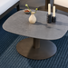Surya Daniella outdoor coffee table with gray matte stone top and dark gray aluminum base.