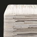 Modern square pouf upholstered in textured cream hair-on-hide, featuring horizontal and vertical stripe patterns.