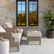 Modern outdoor patio with Surya Hope HOP-2303-P rug, light brown chairs, and white ottoman.