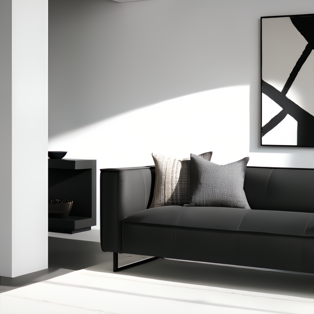 Surya Dylan charcoal top-grain leather sofa with black iron base, two decorative pillows, and modern art.