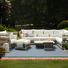 Winder Sectional Left Arm in cream Sunbrella acrylic with aluminum base, shown in an outdoor lounge setting.