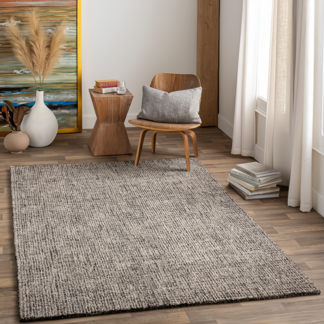 Surya Aiden wool area rug in Ink Blue and Charcoal with a medium pile, adding modern style to a room.