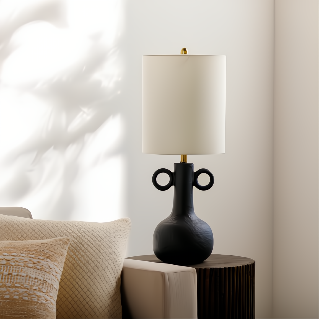 Traditional black ceramic accent table lamp with a white linen shade and gold accents.