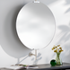 Round wall mirror with a slim black frame, gold-toned hardware, and a white wall mount.