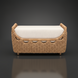 Woven rattan bench with a light beige cushion, featuring a curved design and natural wood legs.