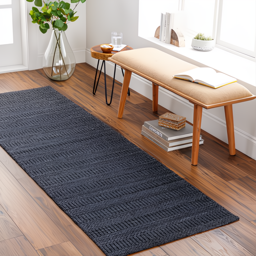 Surya Hickory HCK2300 runner rug in charcoal, black, and gray with subtle texture on a hardwood floor.