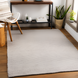 Surya Azalea AZA-2315 light gray hand-woven recycled PET yarn rug with subtle texture in a modern living room.