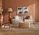 Surya Redondo coffee table with a beige polished marble top and ribbed mango wood base in a modern living room.