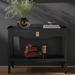 Black Surya Doheny console table with a soft-close drawer, gallery top, and shallow tray shelf.