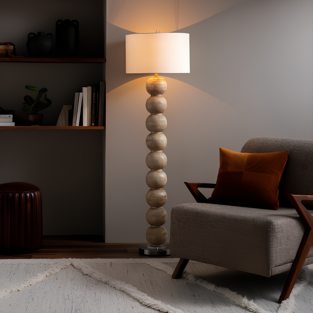 Surya Algarve modern floor lamp with stacked light wood-toned resin spheres, white linen shade, and warm glow.