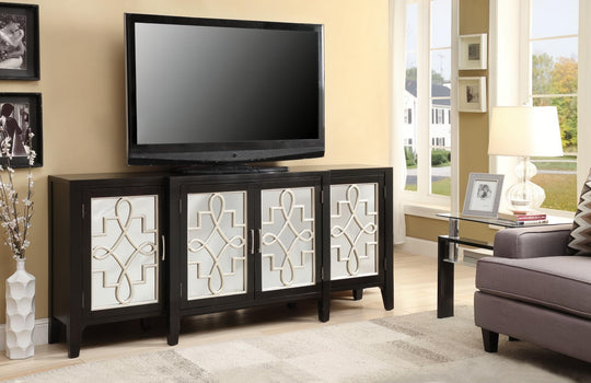Antique black console table with four doors featuring decorative white geometric overlays, holding a TV.