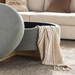 Surya Corson storage ottoman in brown and green polyester with a brown painted rubber wood base, lid open.