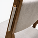 Surya Bergene dining chair with light beige upholstery and brown natural rubber wood frame.