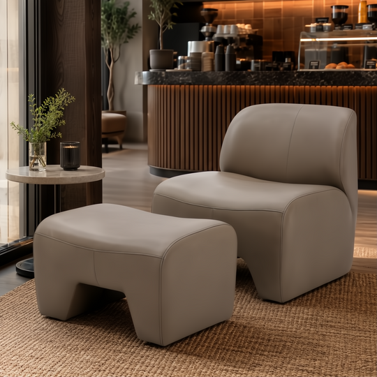 Surya Sable Accent Chair and matching ottoman in taupe, mocha, sandstone, with cushioned seating on a rug.