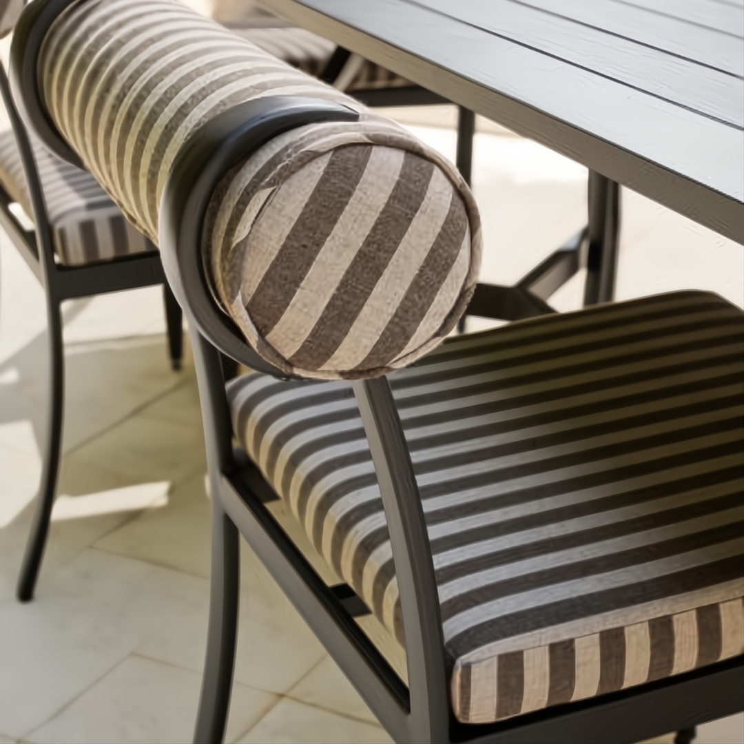 Surya Antibes outdoor dining chair with black powder-coated aluminum base and striped Sunbrella cushion.