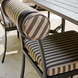 Surya Antibes outdoor dining chair with black powder-coated aluminum base and striped Sunbrella cushion.