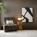 Surya Aasmaa AAM-001 modern abstract black and white wall art above a brown armchair.
