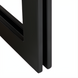 Close-up of the black cast iron base of the Surya Lowmax Coffee Table, showing its minimalist design.