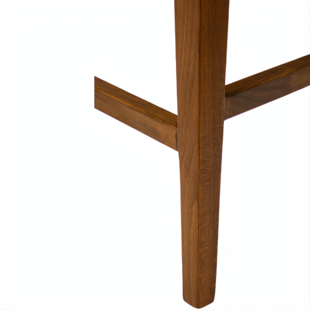 Surya Brooke counter stool with wheat-finished beechwood legs and medium brown polyester seat.