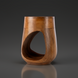 Surya Isiri minimalist modern mango wood end table with a brown finish and unique cutout design.