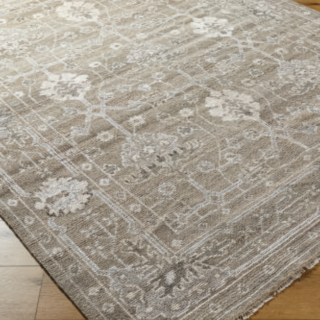 Surya Almeria low pile hand-knotted rug in light brown, medium gray, and cream with elegant floral patterns.