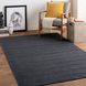 Surya Hickory HCK2300 dark gray hand-loomed rug with subtle texture, made from recycled PET yarn.